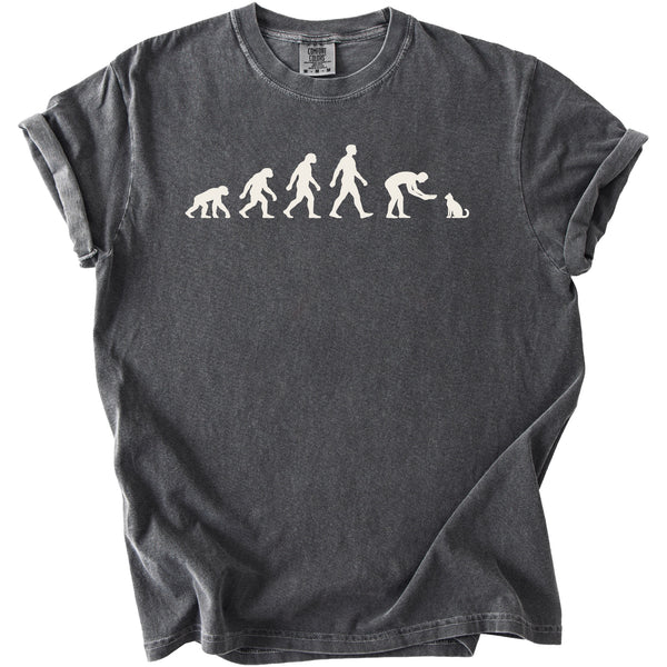 Dark grey t-shirt with white graphic showing evolution from ape to human interacting with cat.