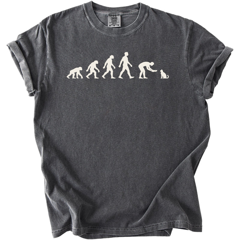 Dark gray t-shirt with white print depicting human evolution culminating in feeding a cat.