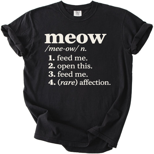 Black t-shirt with "meow" definition including "feed me" and "(rare) affection".