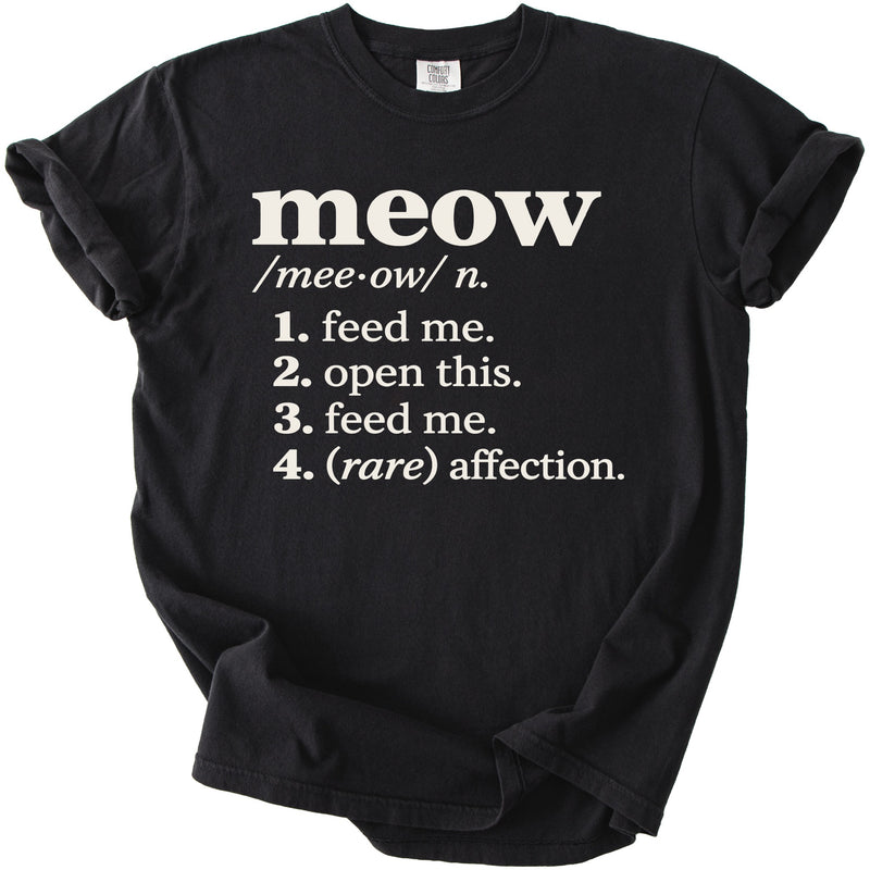 Black t-shirt with "meow" definition including "feed me" and "(rare) affection".