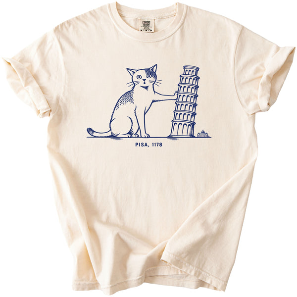 Cream t-shirt with navy line drawing of a cat holding the Leaning Tower of Pisa.