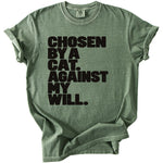 Green t-shirt with black text that reads "CHOSEN BY A CAT. AGAINST MY WILL."