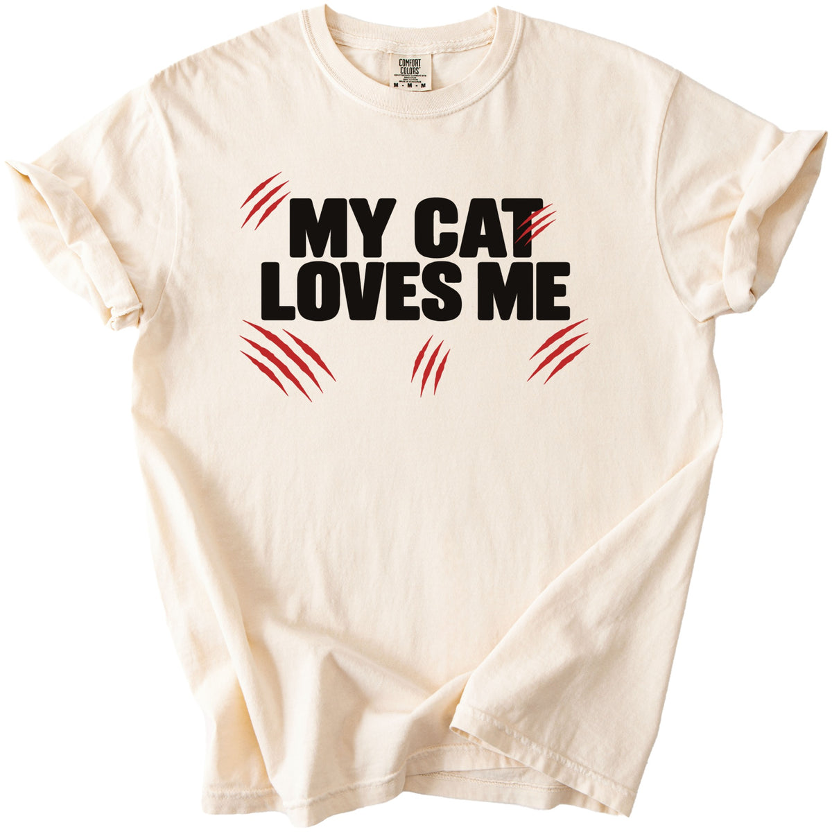 Cream t-shirt with black text "MY CAT LOVES ME" and red claw marks.