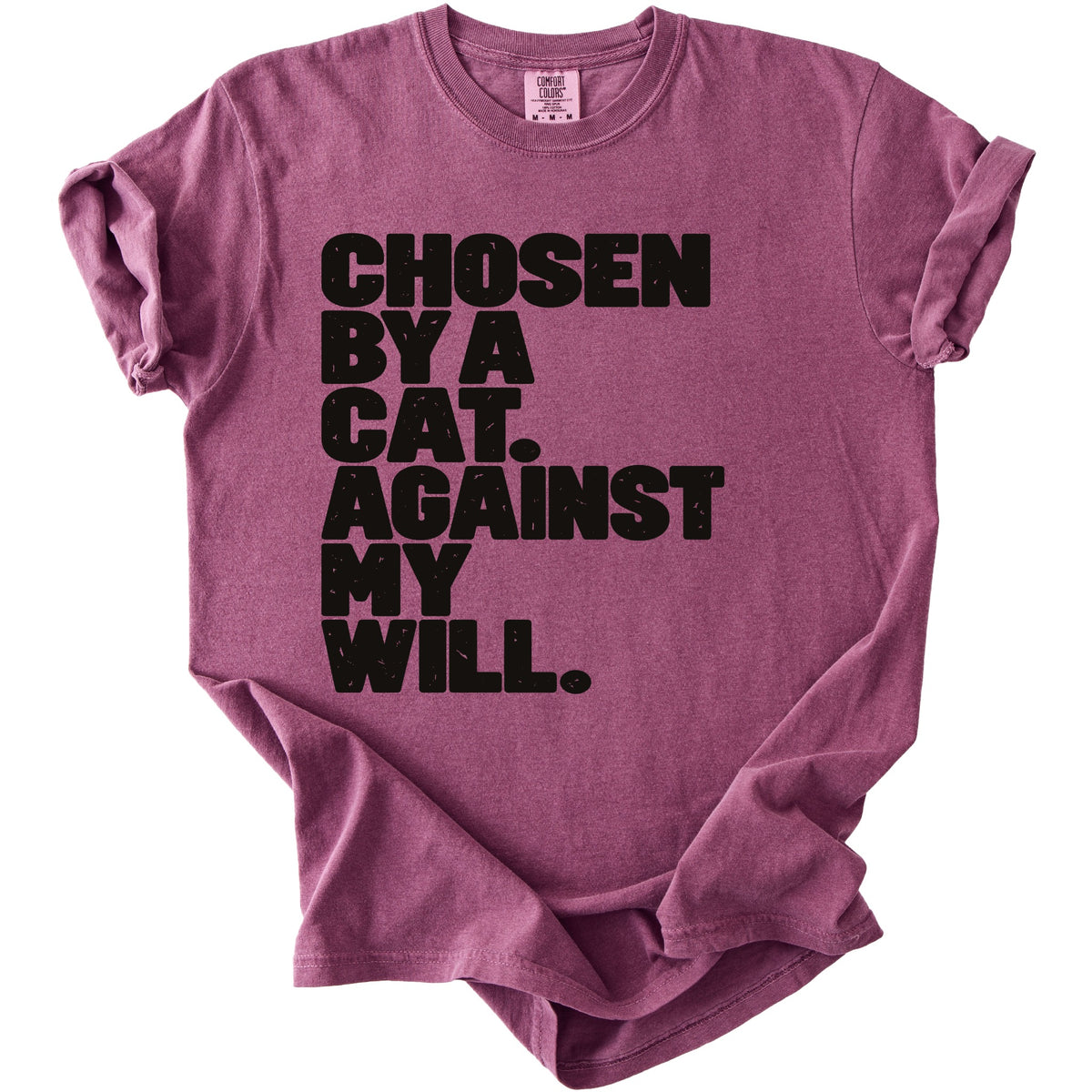 T-shirt with black text reading "CHOSEN BY A CAT. AGAINST MY WILL."