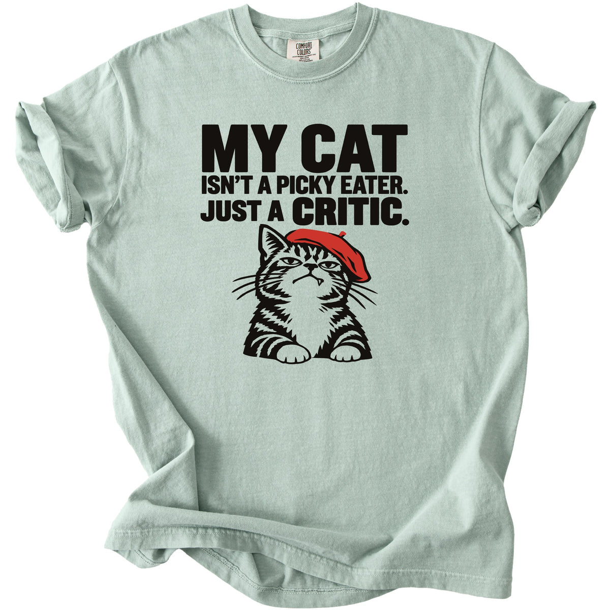 Light blue t-shirt with black text and a tabby cat wearing a red beret.