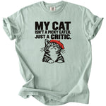 Light blue t-shirt with black text and a tabby cat wearing a red beret.