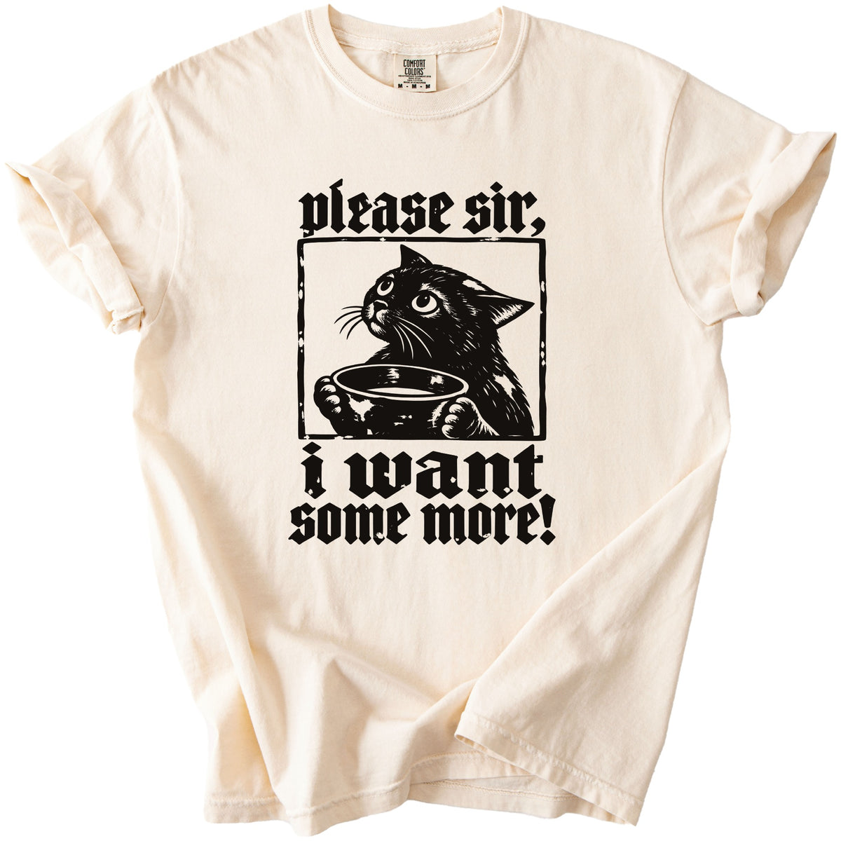 Cream t-shirt with black graphic of a cat holding a bowl and text "please sir, i want some more!".