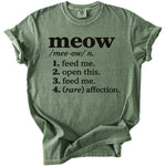 Green t-shirt with black text defining "meow" as "feed me, open this, feed me, (rare) affection."