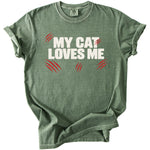 Green t-shirt with "MY CAT LOVES ME" in white text and red scratch marks.