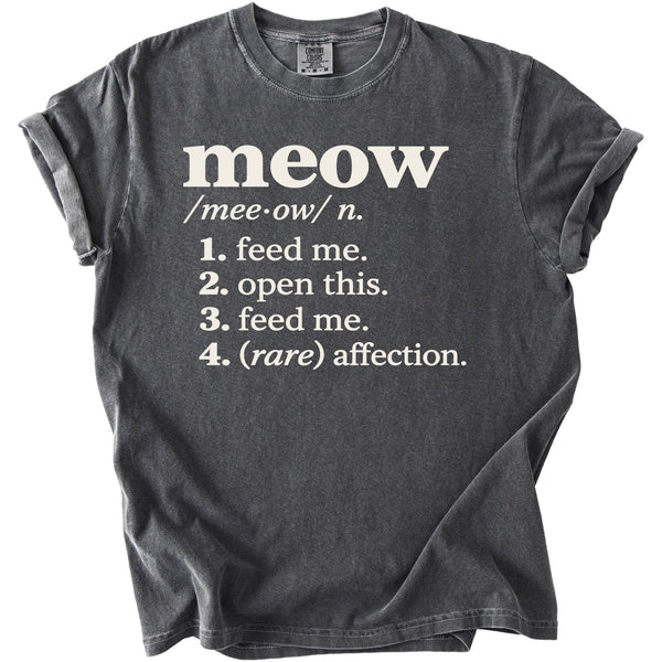 Dark grey t-shirt with "meow" definition: 1. feed me. 2. open this. 3. feed me. 4. (rare) affection.