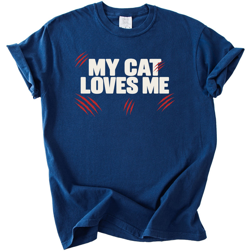 Dark blue t-shirt with white text "MY CAT LOVES ME" and red claw marks.