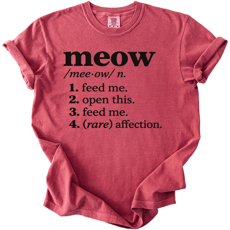 Red t-shirt with "meow" definition: feed me, open this, feed me, rare affection.