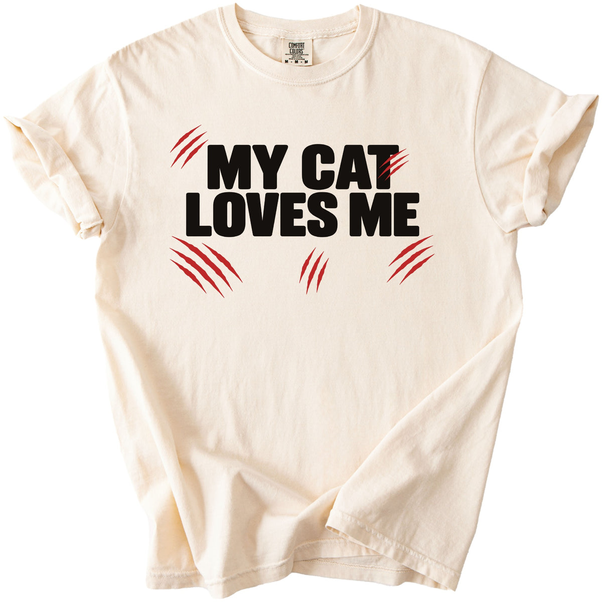 Cream t-shirt with black text "MY CAT LOVES ME" and red claw marks.