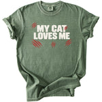 Green t-shirt with "MY CAT LOVES ME" in white and red claw marks.