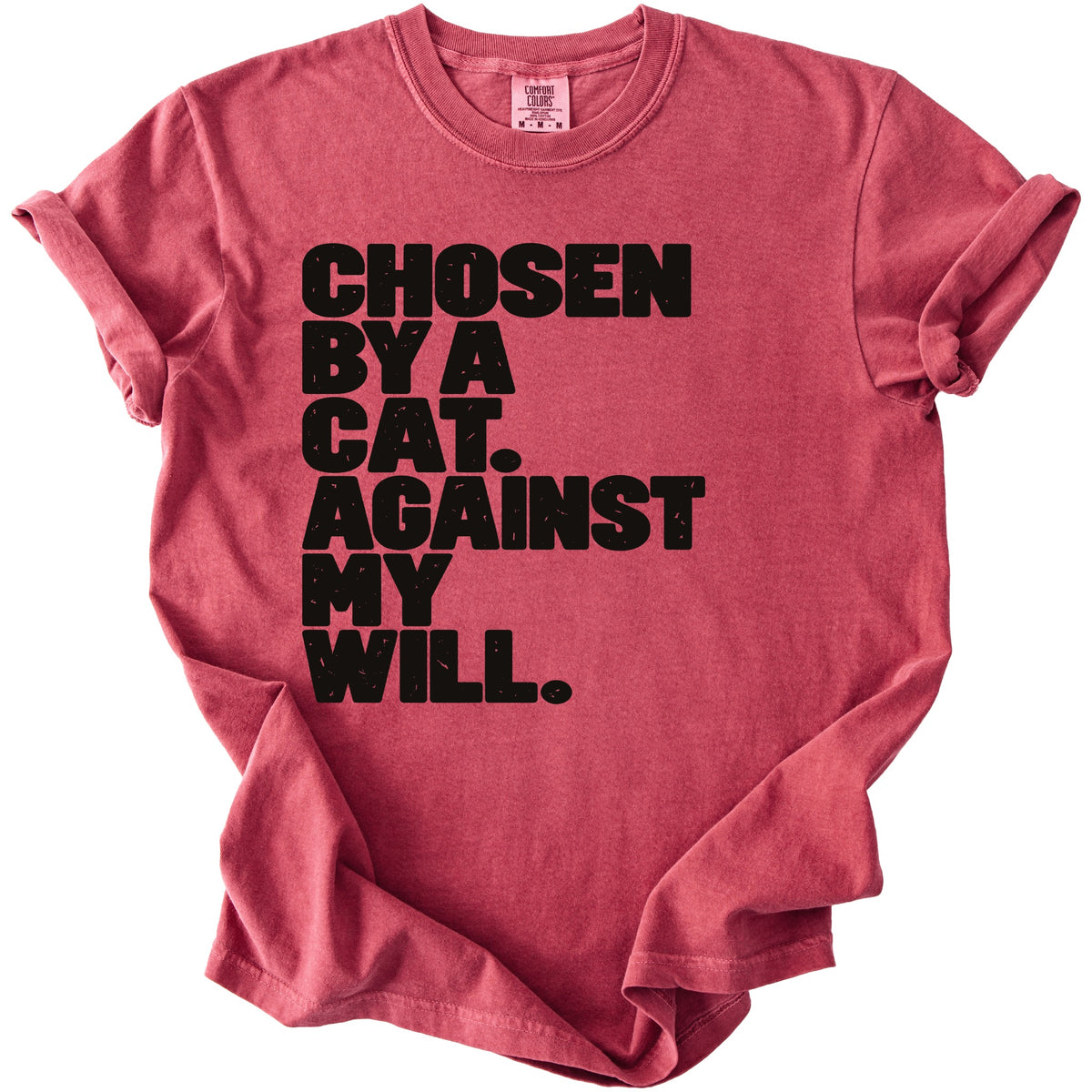 Red t-shirt with black text reading "CHOSEN BY A CAT. AGAINST MY WILL."