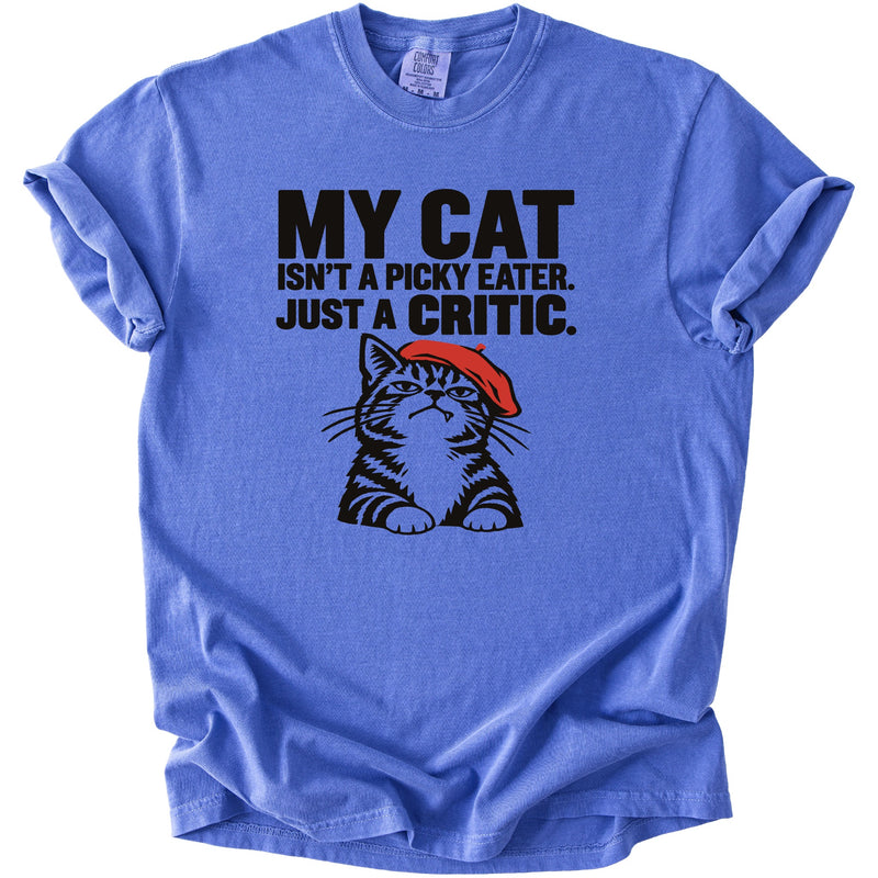 Blue t-shirt with black text "MY CAT ISN'T A PICKY EATER. JUST A CRITIC." and a cat graphic.