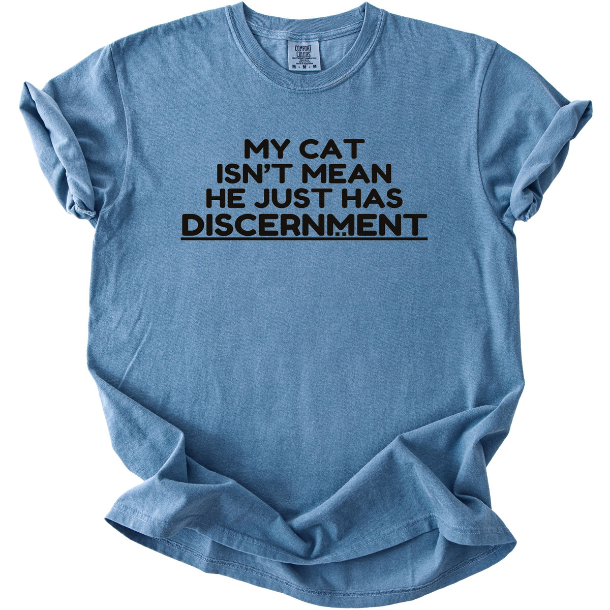 Blue t-shirt with black text reading "My Cat Isn't Mean He Just Has Discernment".