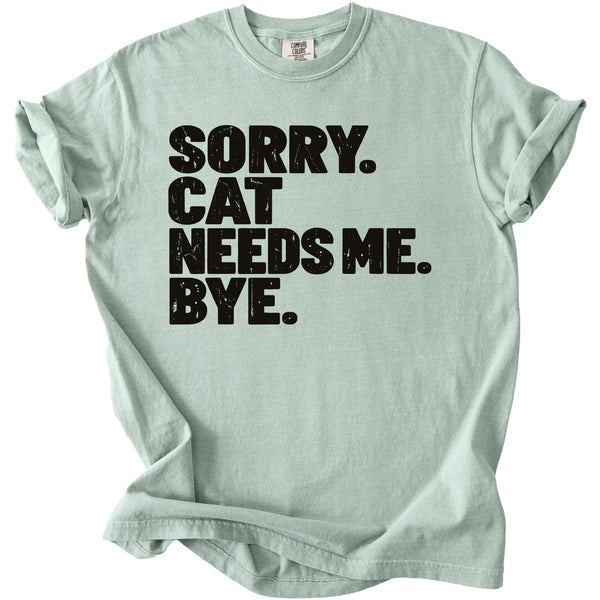 Light green t-shirt with black text that says "SORRY. CAT NEEDS ME. BYE."