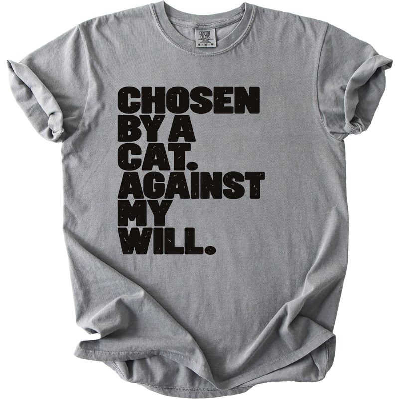 Gray t-shirt with black text: CHOSEN BY A CAT. AGAINST MY WILL.