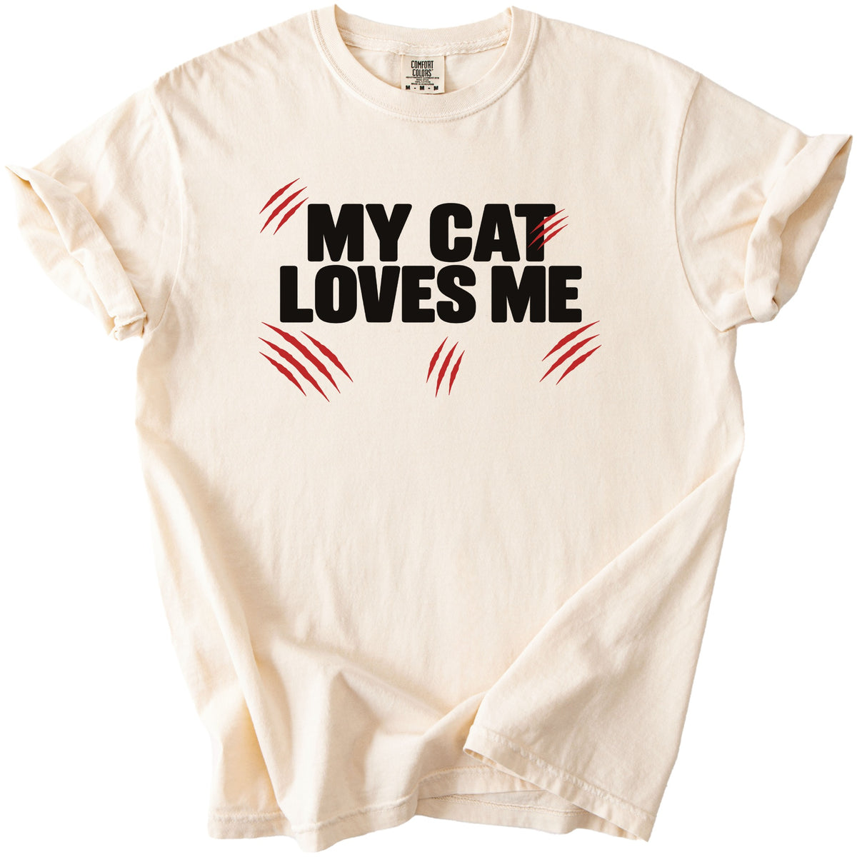 Cream t-shirt with black text "MY CAT LOVES ME" and red claw marks.