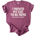 A plum-colored crewneck t-shirt with rolled sleeves features white distressed text that reads I moved my cat to be here (this better be good.).