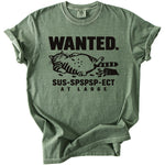 Green t-shirt with black graphic of a fat cat and text "WANTED. SUS-SPSPSP-ECT AT LARGE".