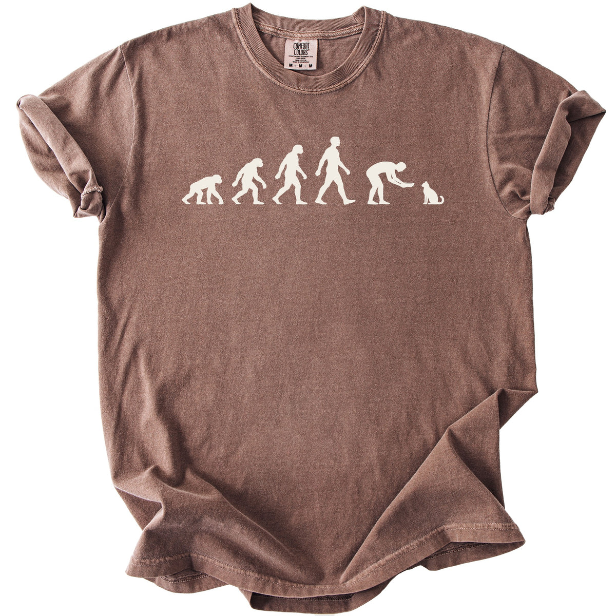 Brown t-shirt with white Comfort Colors tag and a sequence of human evolution figures culminating in petting a cat.