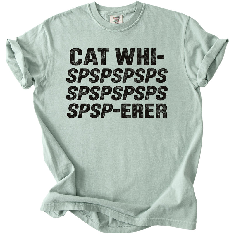 Light green t-shirt with black distressed text reading CAT WHISPSPSPSPSPSPSPSP-ERER across the chest.