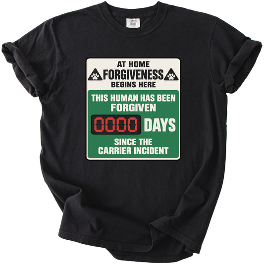 Black t-shirt with "At Home Forgiveness Begins Here" and "0000 Days Since The Carrier Incident" graphic.