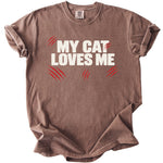 Brown t-shirt with "MY CAT LOVES ME" text and red claw marks.