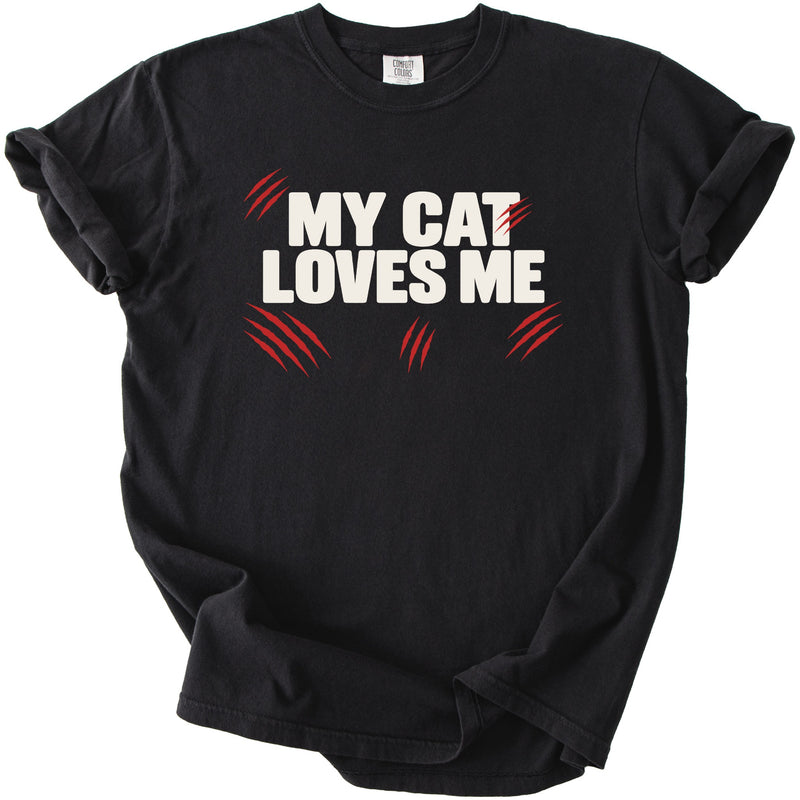 Black t-shirt with white text "MY CAT LOVES ME" and red claw marks.