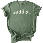 Green t-shirt with white "evolution of man to cat owner" graphic.