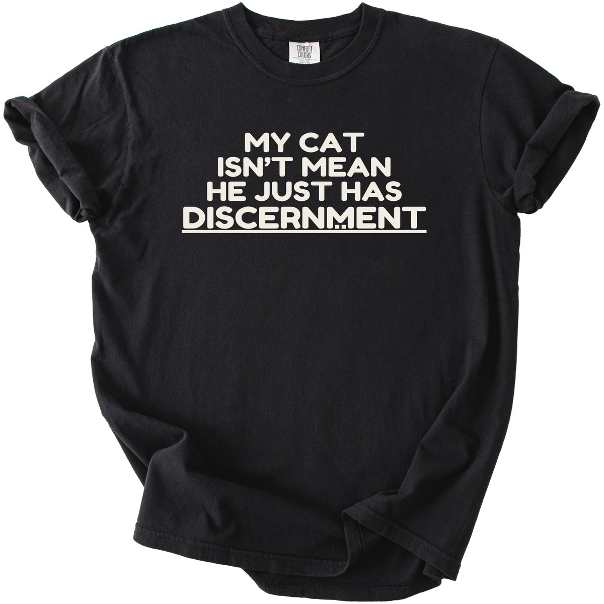 Black t-shirt with white text that reads "MY CAT ISN'T MEAN HE JUST HAS DISCERNMENT".