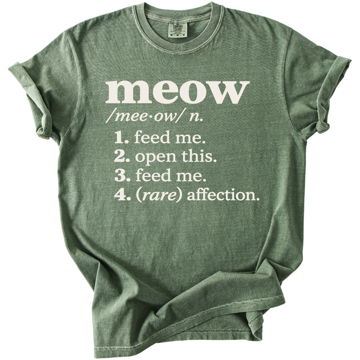 Green t-shirt with "meow" definition: feed me, open this, feed me, (rare) affection.