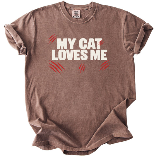 Brown t-shirt with white text "MY CAT LOVES ME" and red claw marks.
