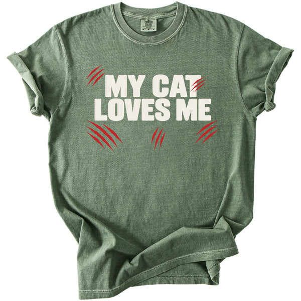 Green t-shirt with "MY CAT LOVES ME" in white, and red claw marks.
